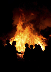 People at a bonfire