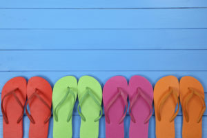 Flip Flops sandals in summer on vacation with copyspace